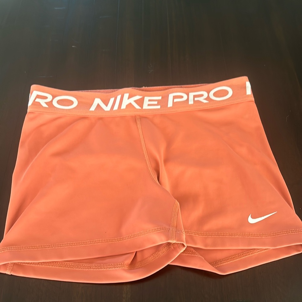 Orange Nike pros